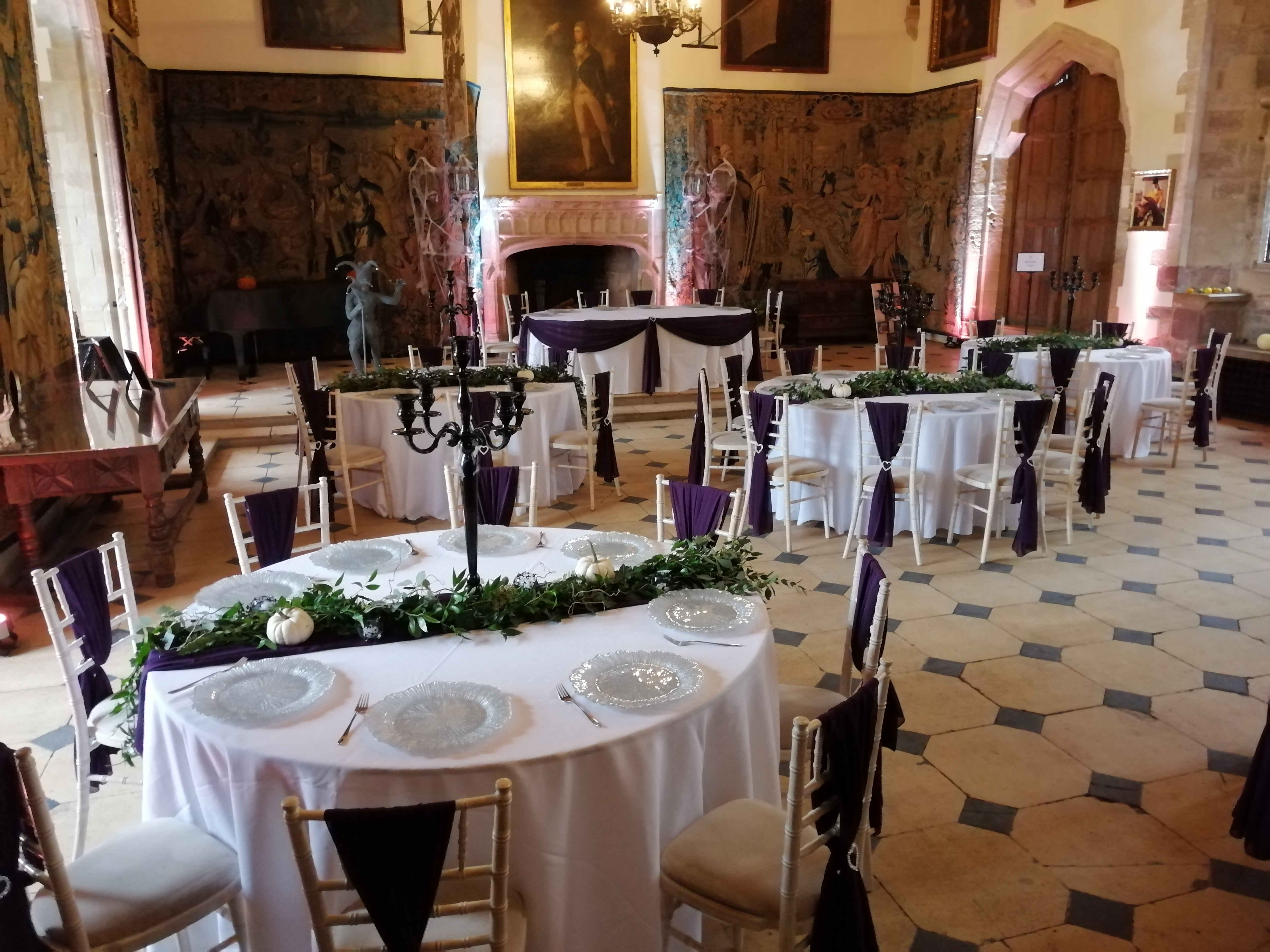 Purple Sashes, Pumpkin Centre Pieces, Black Candelabras & a sprinkle of cobwebs make the hall at Berkley Castle a spooky dream!